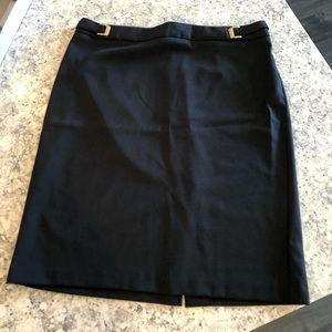 New York & Company black skirt with gold buckles